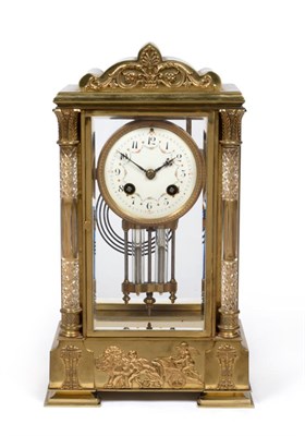 Lot 963 - A Brass Four Glass Striking Mantel Clock, circa 1900, arched case with four bevelled glass...