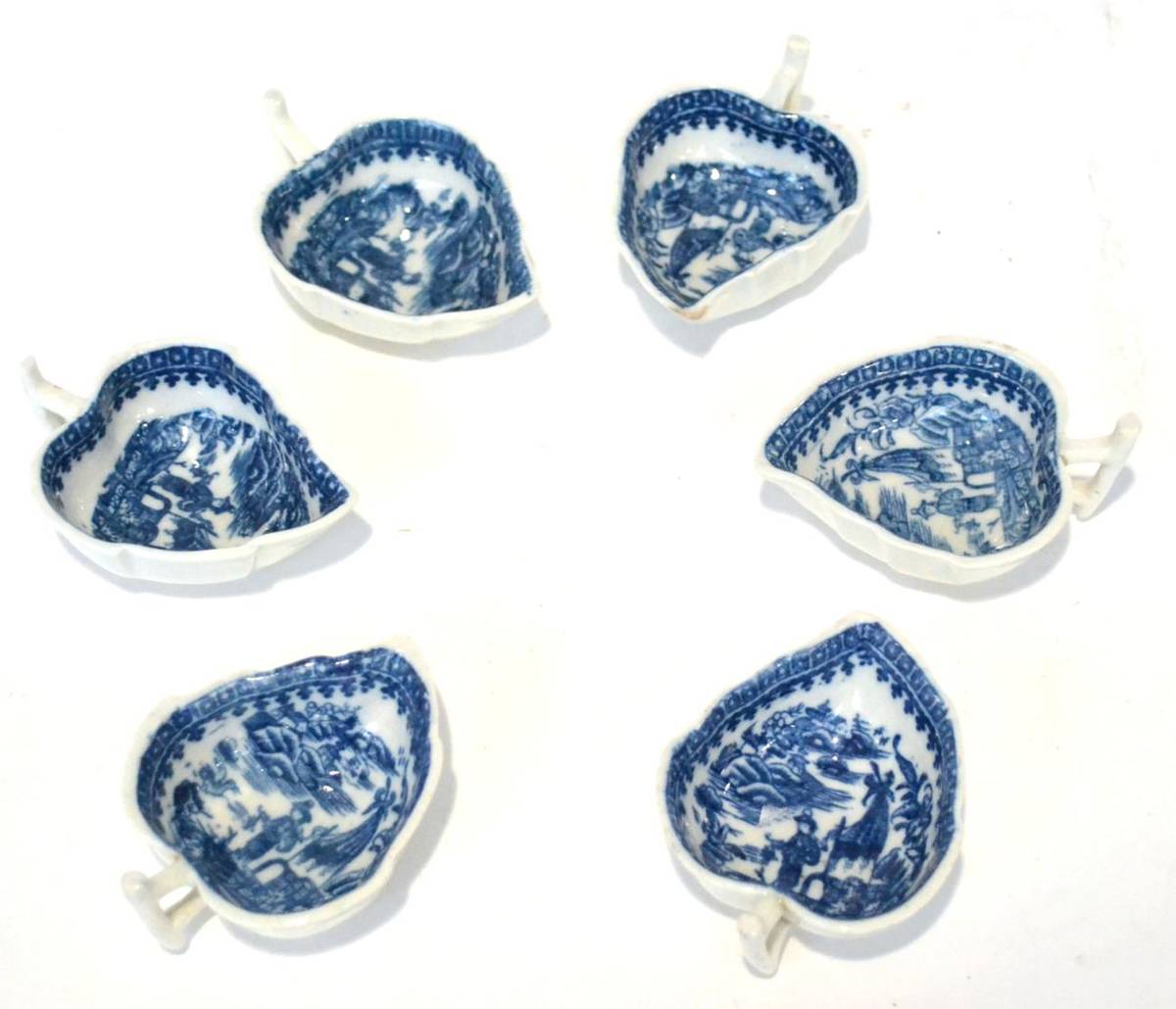 Lot 8 - A Set of Six First Period Worcester Porcelain Leaf Shape Butter Boats, circa 1775, printed in...
