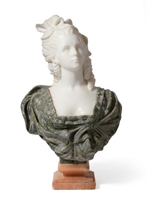 Lot 1008 - A French Marble Bust, in 18th century style, as a lady with her hair tied wearing a green dress, on