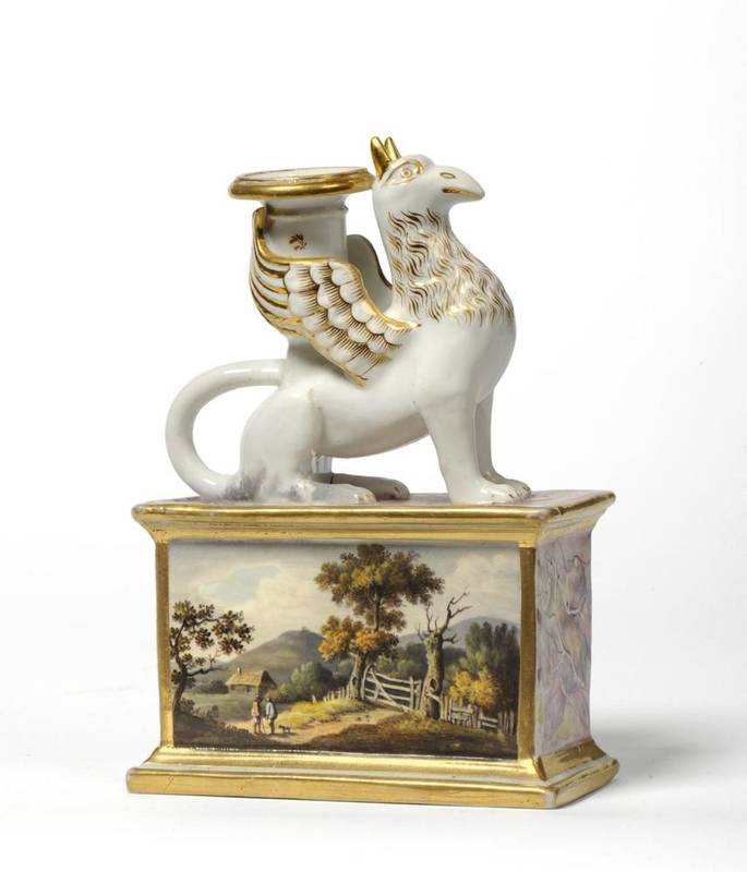 Lot 101 - A Staffordshire Porcelain Chamberstick, circa 1830, as a seated griffin on a rectangular base...