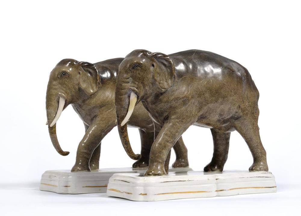 Lot 117 - A Pair of Staffordshire Pottery Figures of Elephants, late 19th century, modelled standing on...