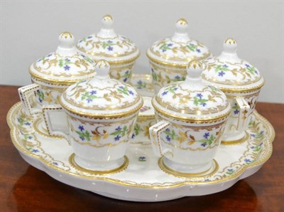 Lot 134 - A Set of Six Paris Porcelain Custard Cups and Covers on Stand, circa 1800, painted with...