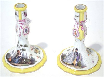 Lot 149 - A Pair of Meissen Style Porcelain Candlesticks, 19th century, of rococo scroll moulded form painted