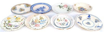 Lot 155 - Four Various Nove Faience Plates, 19th century, painted with flower sprays, the largest 29.5cm...