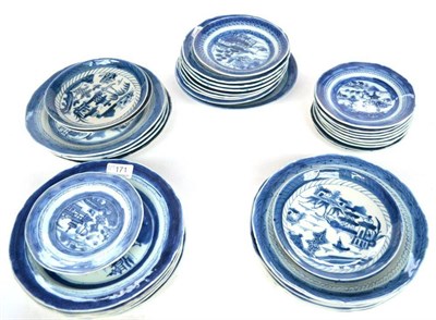 Lot 171 - A Composite Set of Fourteen Chinese Porcelain Plates, circa 1800, painted in underglaze blue with a