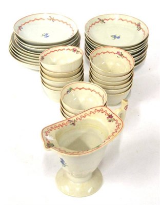 Lot 184 - A Chinese Porcelain Tea Service, circa 1790, painted with forget-me-nots with ribbon tied...