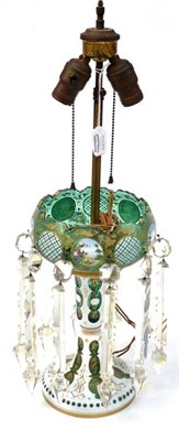 Lot 202 - A Bohemian White Overlay Green Glass Table Lustre, circa 1900, the ovoid bowl painted with...