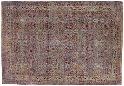 Lot 244 - Large Kirman Carpet South East Persia The polychrome field with an all over design of flowers...