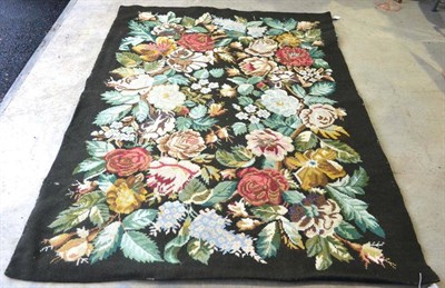 Lot 254 - Needlepoint Rug The charcoal field of naturalistic flowers, 201cm by 144cm; and An American Rug (2)