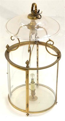Lot 260 - A Brass Mounted Glass Hall Lantern, of cylindrical form with scroll frame and circular shade,...