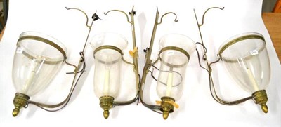 Lot 261 - A Pair of Brass Mounted Glass Wall Lanterns, with ovoid bowls and circular smoke shades,...
