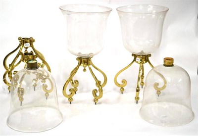 Lot 276 - A Set of Four Brass Lanterns, the bell shaped glass bowls raised on S shaped scrolled supports with