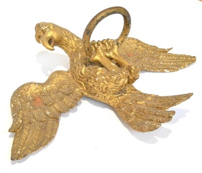 Lot 279 - An Early 19th Century Carved Giltwood and Gesso Eagle, with outswept wings, its claws grasping...