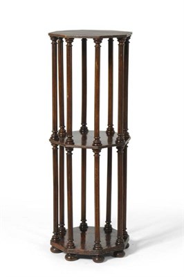 Lot 296 - A Stained Beech Octagonal Bookstand, with turned and fluted column supports, on flattened bun feet