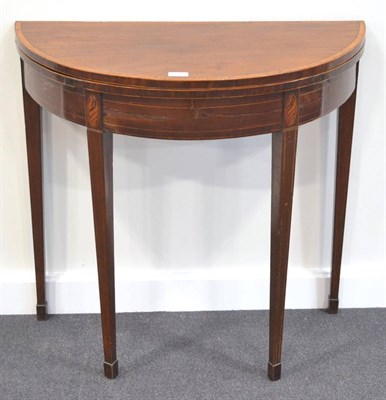 Lot 302 - A George III Mahogany Crossbanded, Boxwood and Ebony Strung Foldover Table, late 18th century, of D