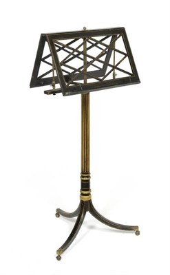 Lot 327 - A Regency Ebonised and Parcel Gilt Duet Stand, early 19th century, the folding rests above an...