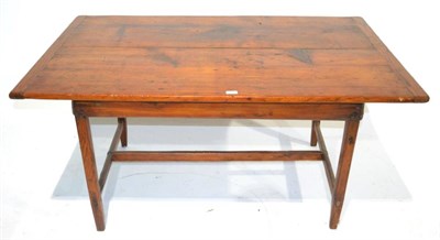 Lot 335 - A 19th Century Pine Kitchen Table, of plank construction with cleated ends and plain frieze, raised