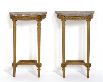 Lot 338 - A Pair of Carved Pine Demi-Lune Console Tables, with pink and white veined marble top, carved...