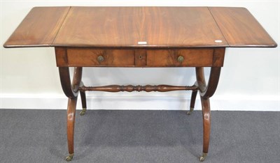 Lot 344 - A North European Mahogany Sofa Table, mid 19th century, the rounded drop leaves above two...