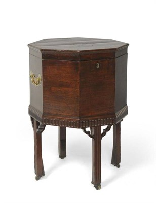Lot 349 - A George III Mahogany and Tulipwood Banded Octagonal Shaped Wine Cooler, late 18th century, the...