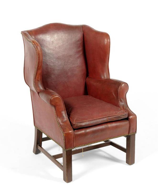Lot 354 - A Child's Wing Back Armchair, late 19th/early 20th century, upholstered in close-nailed red...
