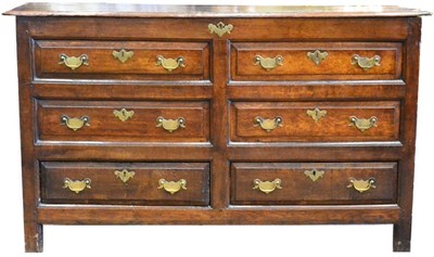 Lot 1067 - A George III Joined Oak Chest, circa 1760,  the hinged lid above four sham drawers and two real...