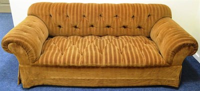 Lot 376 - A Chesterfield Three-Seater Sofa, probably DeAngelis, upholstered in brown buttoned corduroy...