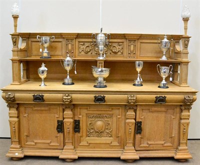 Lot 1073 - A Victorian Carved Oak Sideboard, the superstructure of breakfront form with dentil cornice above a