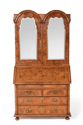 Lot 1095 - An 18th Century Burr Walnut and Feather Banded Dome Top Bureau Bookcase, the later mirror doors...