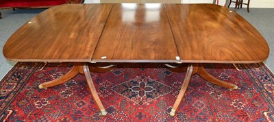 Lot 1482 - A Late George III Mahogany Twin Pedestal Dining Table, with one additional leaf raised on...