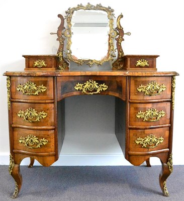 Lot 1112 - A South German Walnut and Gilt Metal Mounted Serpentine Shaped Kneehole Dressing Table, the...