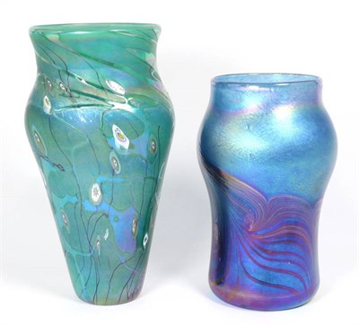 Lot 16 - John Ditchfield for Glasform; an iridescent blue vase decorated with feathers in iridescent...