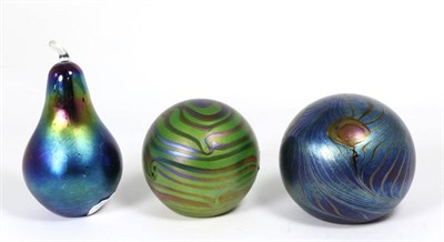 Lot 28 - John Ditchfield for Glasform; an iridescent green paperweight decorated with bands, etched to...
