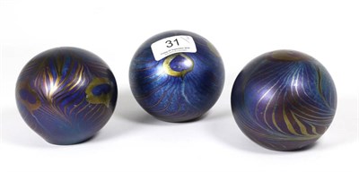 Lot 31 - John Ditchfield for Glasform; an iridescent petroleum paperweight decorated with trails and...