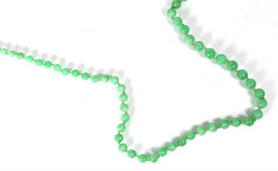 Lot 196 - A jade bead necklace, graduated jade beads knotted to a jump ring clasp, length 85cm