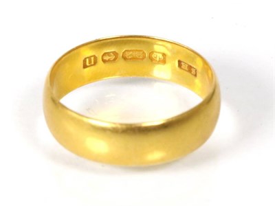 Lot 206 - A 22 carat gold band ring, finger size Q1/2