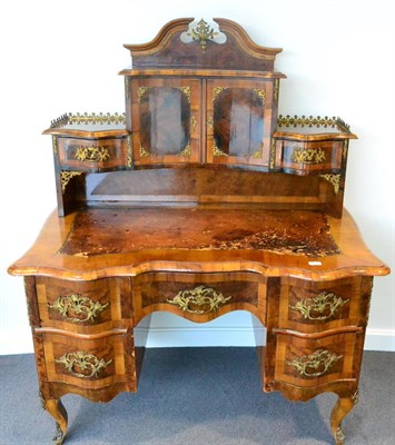 Lot 1148 - A Mid 19th Century South German Figured Walnut Writing Desk, of serpentine shaped form with...