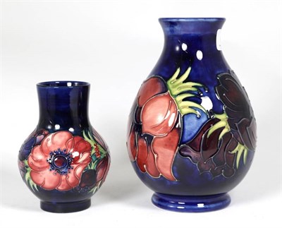 Lot 134 - Moorcroft Pottery: two poppy pattern vases