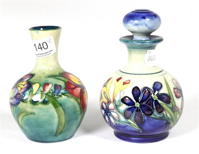 Lot 140 - Moorcroft Pottery: a Freesia pattern vase and a Spring Flowers pattern scent bottle