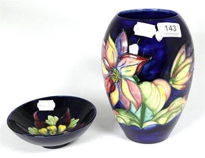 Lot 143 - Moorcroft Pottery: a Clematis pattern vase and a Columbine pattern bowl