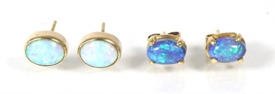 Lot 147 - A pair of black opal stud earrings, oval cabochon black opal in claw settings, with post...