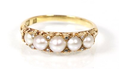 Lot 151 - A split pearl ring, ring stamped 18