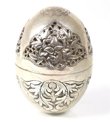 Lot 155 - An Oriental white metal pomander, egg shaped with pierced cover, indistinct character mark to base