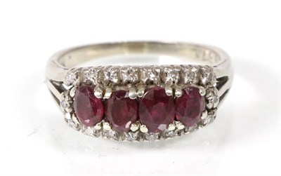 Lot 156 - A ruby and diamond ring, four graduated oval cut rubies within a border of eight-cut diamonds,...