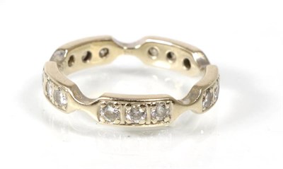 Lot 176 - A diamond eternity ring, of groups of three round brilliant cut diamonds, total estimated...