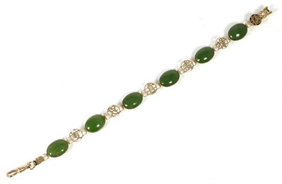 Lot 177 - A nephrite bracelet, oval nephrite links spaced by Chinese character mark links, length 20.1cm,...