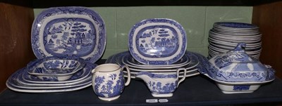 Lot 224 - A collection of late 19th century blue and white Willow pattern transfer printed pottery...