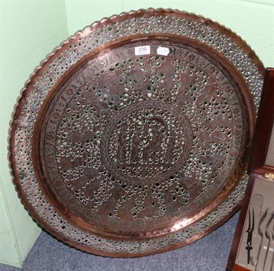 Lot 239 - A large middle eastern copper tray with pierced decoration