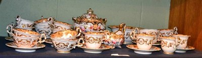 Lot 247 - An early 19th century English part teaset by W & R Daniel, hand painted floral design with gilt...