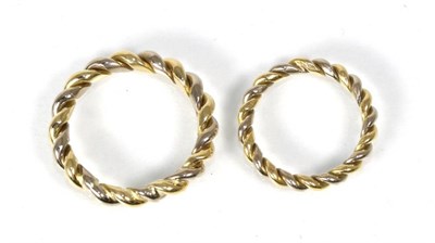 Lot 259 - A pair of matching band rings, of two colour twisted design, finger size R1/2 and L (2)